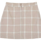 Girls’ Perrin Pocket Flannel Skirt by The Beaufort Bonnet Company in beige plaid with white and light gray stripes, featuring an elastic waistband, back zipper closure, and A-line silhouette, displayed laid flat on a white background.