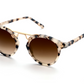 The Krewe St Louis sunglasses by Krewe boast a tortoise-shell pattern with a handcrafted frame, featuring 24K gold-plated accents and brown gradient lenses, beautifully displayed on a white background.