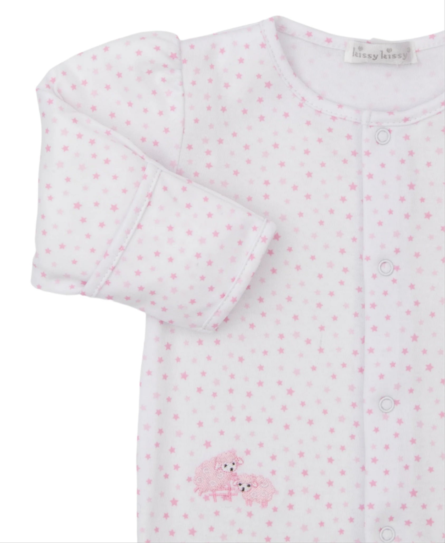 The Kissy Kissy Baa Baa Baby Sheep Star Footie is a white baby onesie made from soft Pima cotton with a pink star pattern, button closure, and an embroidered sheep design on the side.