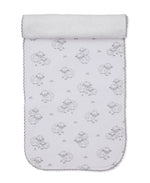 Introducing the Kissy Kissy Sweet Sheep Burp Cloth: crafted from white Pima cotton and featuring adorable gray cartoon sheep and grass details, rounded edges, and a delicate scalloped trim. Soft and versatile, it comes partially rolled at the top—perfect as a cozy layer or as a gentle burp cloth for your baby.