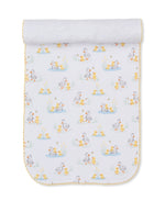 Introducing the Duck Pond Paddles Burp Cloth by Kissy Kissy—a white Pima cotton cloth edged in yellow, adorned with a charming repeating print of ducks and ducklings among ponds and grass. Soft and comfortable, it is rolled at the top and displayed flat on a white background, making it ideal for gentle burping or as a cozy companion to your favorite baby blankets.