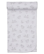 The Kissy Kissy Springtime Bunny Fun Blanket is a white Pima cotton baby blanket with gray outline drawings of rabbits and trees, neatly rolled at the top.