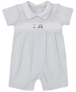 The Kissy Kissy Fairway Foursome Stripe Short Playsuit is a light blue baby playsuit made from soft Pima cotton, featuring a white collar, short sleeves, and colorful golf equipment embroidery on the chest.