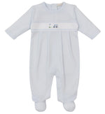 The Kissy Kissy Premier Fairway Foursome Striped Hand Emb Footie is a pale blue Pima cotton onesie featuring long sleeves, cozy footies, and small embroidered truck and scooter designs on the front panel.