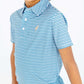 Smiling child wearing The Beaufort Bonnet Company Boys’ Prepletic™ Prim & Proper Polo, showcasing blue and white stripes with short sleeves, paired with light blue pants, standing against a plain white background.