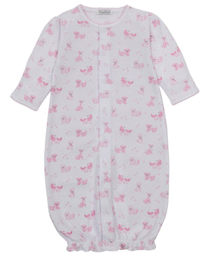 Kissy Kissy Baby Puppy Paws Printed Convertible Gown features long sleeves, a pink puppy paws print, front snap closures, and an elasticized hem at the bottom.