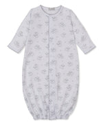 The Kissy Kissy Baby Sweet Sheep Convertible Gown features long sleeves, a white Pima cotton fabric with a gray sheep print, elasticized cuffs at the feet, front snap buttons, and scalloped trim at the sleeves.