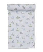 The Kissy Kissy Safari Party Blanket, crafted from white Pima cotton and adorned with blue, green, and gray animal illustrations—featuring hippos and alligators—is shown laid flat with a softly folded corner and top edge, making it the perfect choice for your little one's next safari adventure.