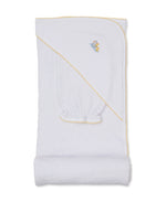 The Duck Pond Paddles Hooded Towel with Mitt by Kissy Kissy features a white design with yellow trim and an embroidered duck, neatly folded to showcase the hooded corner. Crafted from soft Pima cotton, this gentle and absorbent bathtime towel is perfect for your little one.