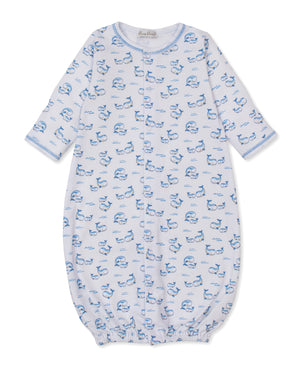 The Kissy Kissy Baby Whale Pods Convertible Gown, crafted from light blue Pima cotton and adorned with a charming whale pods print featuring blue whales and fish, showcases long sleeves and elasticized bottom and cuffs, displayed flat on a white background.