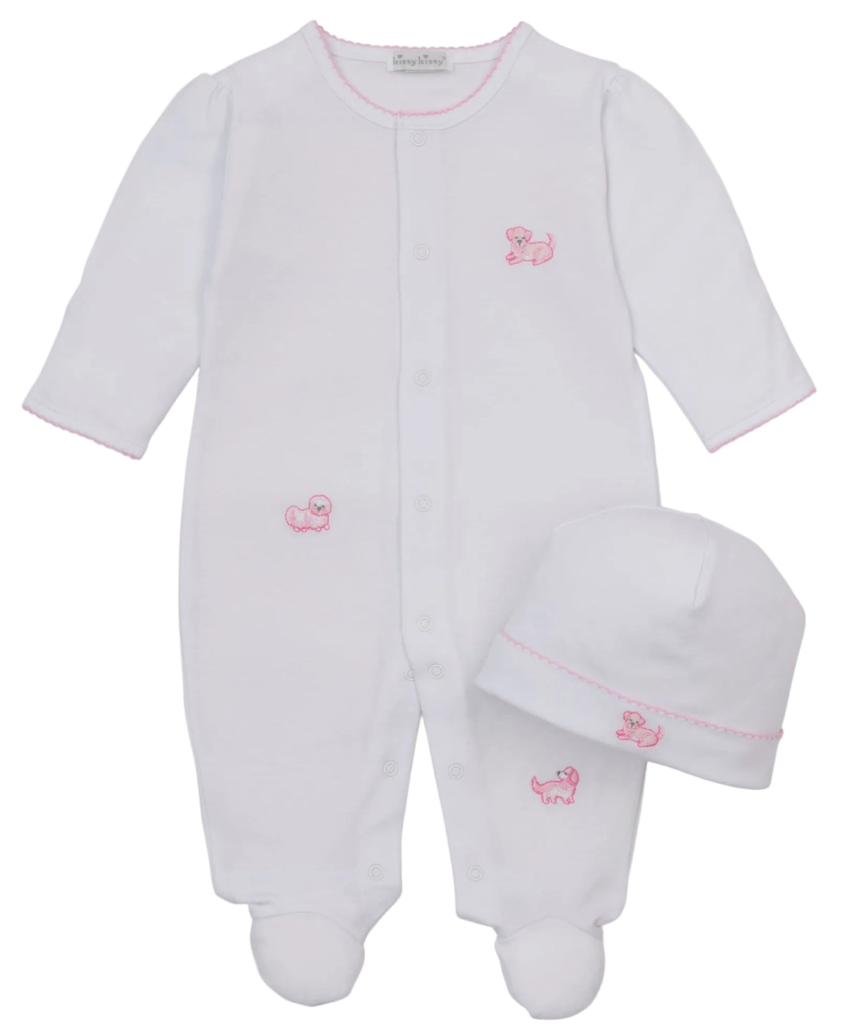 The Kissy Kissy Baby Puppy Paws Footie & Hat Set, crafted from soft Pima cotton, features a white infant sleeper adorned with pink stitched animal details and comes with a matching beanie hat, all displayed on a plain background.