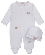 The Kissy Kissy Baby Puppy Paws Footie & Hat Set showcases a charming white infant footie and matching hat, both made from soft Pima cotton and adorned with small embroidered tan puppies and delicate brown stitching accents.