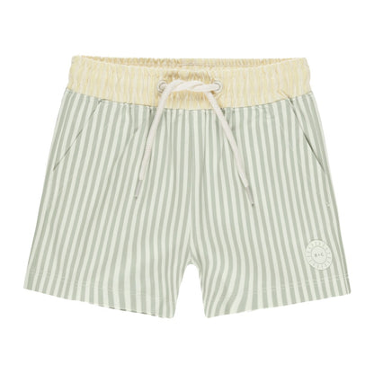 The Rylee + Cru Board Short by Rylee & Cru features green and white stripes, a yellow elastic waistband with drawstring, side pockets, and a circular logo on one leg—ideal for a stylish matching swim ensemble.