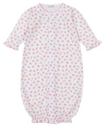The Kissy Kissy Baby Girls' Sea Shell Magic Convertible Gown is a white Pima cotton romper with pink trim, decorated with sea shell, starfish, and crab prints in pink, yellow, and purple.