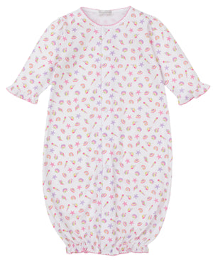 The Kissy Kissy Baby Girls' Sea Shell Magic Convertible Gown is a white Pima cotton romper with pink trim, decorated with sea shell, starfish, and crab prints in pink, yellow, and purple.