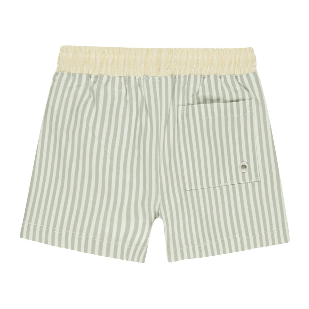 The Rylee + Cru Board Short by Rylee & Cru features green and white vertical stripes with a yellow waistband, a back pocket, and a button detail, making it perfect for a matching swim set.