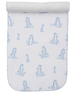 The Kissy Kissy Giraffe Grace Burp Cloth is crafted from soft Pima cotton and adorned with blue giraffe prints and scalloped edges, rolled at the top.