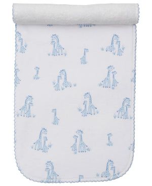 The Kissy Kissy Giraffe Grace Burp Cloth is crafted from soft Pima cotton and adorned with blue giraffe prints and scalloped edges, rolled at the top.