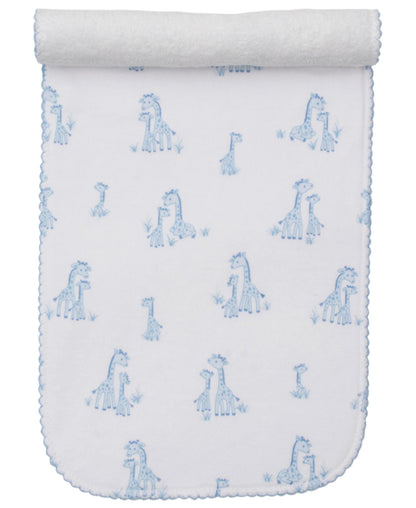 The Kissy Kissy Giraffe Grace Burp Cloth is crafted from soft Pima cotton and adorned with blue giraffe prints and scalloped edges, rolled at the top.