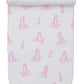 The Kissy Kissy Giraffe Grace Burp Cloth features white Pima cotton with pink giraffe prints and scalloped edges, rolled at the top.
