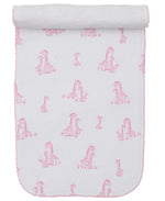 The Kissy Kissy Giraffe Grace Burp Cloth features white Pima cotton with pink giraffe prints and scalloped edges, rolled at the top.