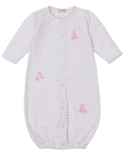 The Kissy Kissy Baby' Giraffe Grace Dotted Convertible Gown features soft white Pima cotton, pink polka dots, long sleeves, front snaps, and sweet pink giraffe accents for cozy comfort and adorable style.