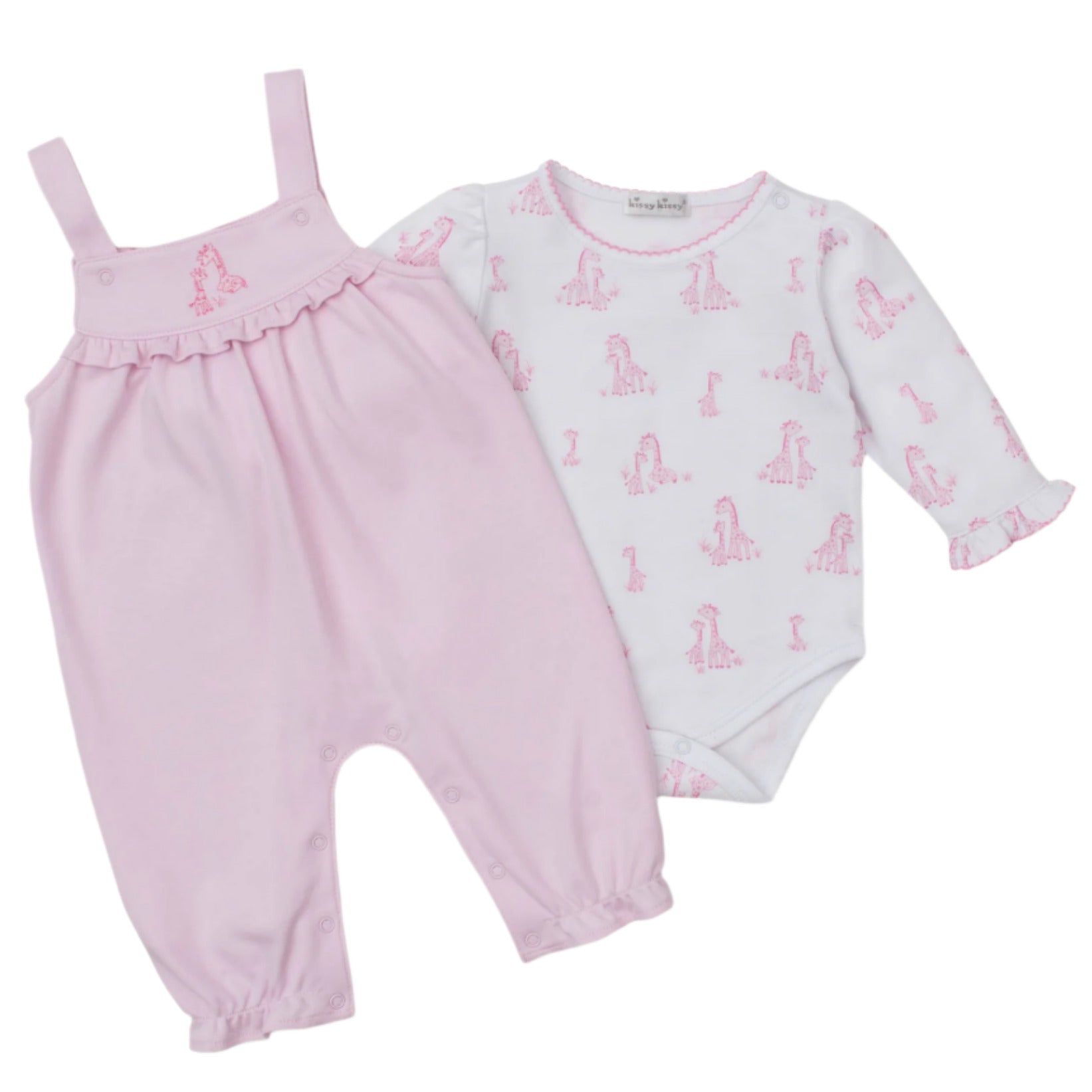 The Kissy Kissy Baby' Giraffe Grace Overall Set features pink baby overalls with ruffled straps and a long-sleeve pima cotton bodysuit adorned with a cute pink giraffe print.