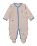 The Baby Boys' Vintage Toy Fun Footie by Kissy Kissy is a beige and white striped sleeper made from soft Peruvian cotton, featuring blue trim, small embroidered animals, long sleeves, and cozy covered feet—adorably displayed on a white background.