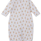 The Kissy Kissy Baby Teddy Bear Time Convertible Gown features soft white Pima cotton, long sleeves, a button front, an all-over teddy bear print, and an elastic bottom hem for comfort.