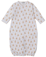 The Kissy Kissy Baby Teddy Bear Time Convertible Gown features soft white Pima cotton, long sleeves, a button front, an all-over teddy bear print, and an elastic bottom hem for comfort.