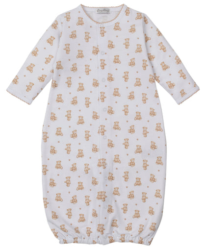 The Kissy Kissy Baby Teddy Bear Time Convertible Gown features soft white Pima cotton, long sleeves, a button front, an all-over teddy bear print, and an elastic bottom hem for comfort.