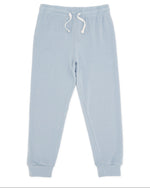 The Feather 4 Arrow Baby and Kids’ Hudson Hacci Jogger features a light blue relaxed fit with an elastic waistband, white drawstring, and cuffed ankles, shown laid flat on a white background.