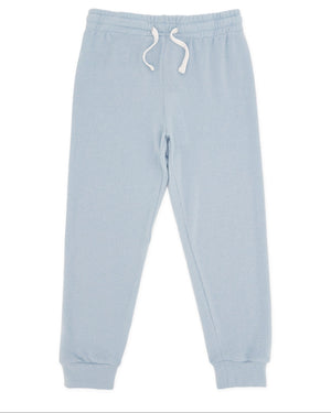 The Feather 4 Arrow Baby and Kids’ Hudson Hacci Jogger features a light blue relaxed fit with an elastic waistband, white drawstring, and cuffed ankles, shown laid flat on a white background.