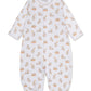 The Kissy Kissy Baby Beary Blessed Convertible Gown is a white infant romper crafted from soft Pima cotton, featuring long sleeves and an adorable teddy bear and toy block print. Designed with snap buttons down the front and elastic cuffs at the wrists and ankles, this versatile playsuit easily converts into a cozy baby gown for added convenience.