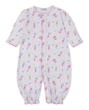 Kissy Kissy Baby Girls' Underwater Mermaids Convertible Gown features long sleeves, a charming pink mermaid and sea creature print on white fabric, soft pink trim at the cuffs and neckline, and convenient front snap buttons for easy changes.