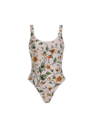 The Gema One Piece by Agua By Aguabendita is a scoop-neck swimsuit made from recycled polyester, featuring a colorful floral print on a light background with UPF 50 protection, shown against a white backdrop.