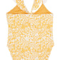 The Feather 4 Arrow In a Cinch One-Piece Swimsuit, designed for girls, features a yellow and white floral pattern with ruffled shoulder straps, making it ideal for both pool and beach adventures.