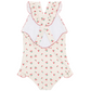 The Minnow Girls' Summer Cherries Ruffle Edge One Piece is a cute swimsuit with ruffled cross-back straps, pink trim, and cherry print, shown flat on a white background.