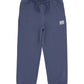 The Feather 4 Arrow Boys’ Wyatt Jogger features a dark blue color, an elastic adjustable waistband with a drawstring, and elastic cuffs. Designed for everyday comfort, these sweatpants include a small rectangular patch sewn near the left pocket.