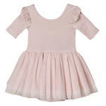 The Noralee Baby Girls’ and Girls’ Thea Tutu features a light pink, ballet-inspired design with short ruffled sleeves and a flared tulle skirt adorned with subtle sparkles, shown on a white background.