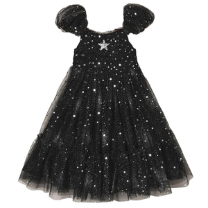 The Noralee Girls’ Clara Dress Silver Stars features a smocked bodice, puffed sleeves, and a tulle skirt embellished with silver star patterns, accented by a large silver star at the chest.