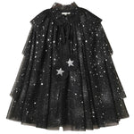 The Noralee Tulle Cape features layered black sheer fabric adorned with silver stars and glitter, a ruffled neckline, and two star-shaped pom-poms suspended from black ribbons—making it perfect for dress-up or any special occasion.