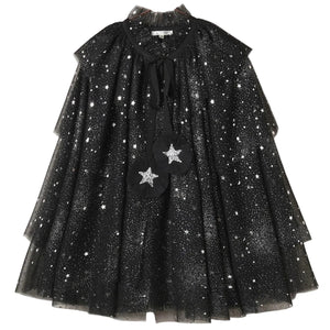 The Noralee Tulle Cape features layered black sheer fabric adorned with silver stars and glitter, a ruffled neckline, and two star-shaped pom-poms suspended from black ribbons—making it perfect for dress-up or any special occasion.
