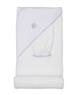 The Kissy Kissy Sweet Sheep Hooded Towel with Mitt is crafted from luxurious Pima cotton and features a white hood adorned with a delicate blue embroidered sheep design and matching trim. The towel is displayed with the hood and coordinating wash mitt visible.