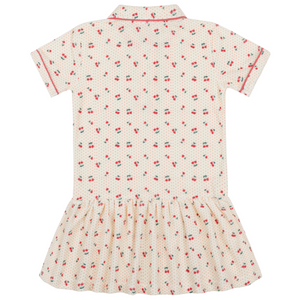 The Minnow Girls' Summer Cherries French Terry Drop Waist Tennis Dress features a cream color, short sleeves, collar, gathered skirt, and a red cherry and green leaf print, shown from the back.