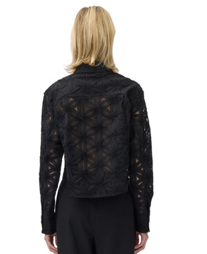 Model with shoulder-length blonde hair shown from the back wearing the Simkhai Anders Shirt and black pants against a plain white background.