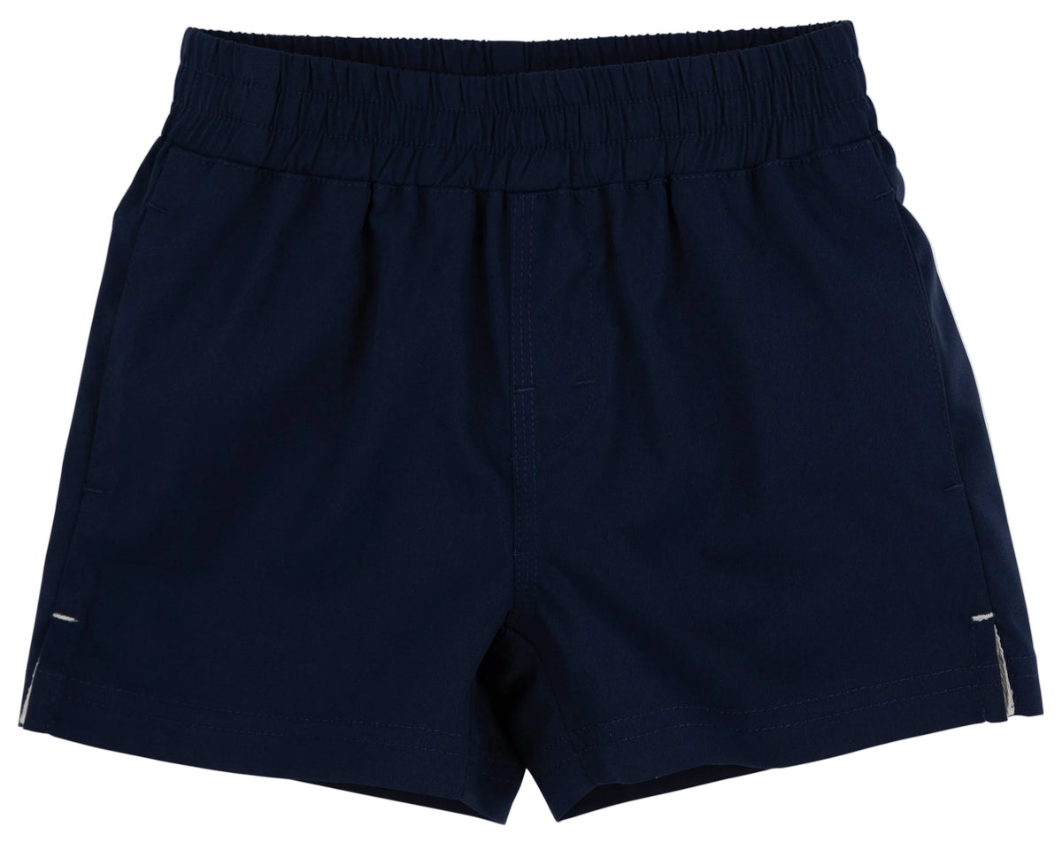 Navy blue pull-on shorts with an elastic waistband and side pockets, the Baby Boys’ and Boys’ Prepletic™ Sheffield Shorts from The Beaufort Bonnet Company are displayed on a white background.