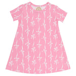 A Baby Girls’ and Girls’ Polly Play Dress by The Beaufort Bonnet Company, in pink with a white bow pattern and short sleeves, made from soft Pima Cotton Knit, is displayed flat against a white background.