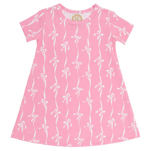A Baby Girls’ and Girls’ Polly Play Dress by The Beaufort Bonnet Company, in pink with a white bow pattern and short sleeves, made from soft Pima Cotton Knit, is displayed flat against a white background.