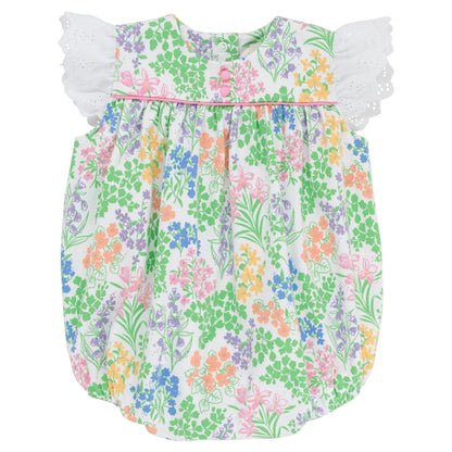 The Beaufort Bonnet Company’s Baby Girls’ Angel Sleeve Blythe Bubble features a colorful floral print, white eyelet lace flutter sleeves inspired by its signature angel sleeve design, and a gathered neckline crafted from soft Pima Cotton, showcased against a white background.